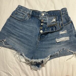Distressed multi button shorts